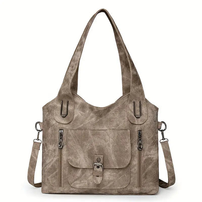Emilia’s spacious retro-style shoulder bag