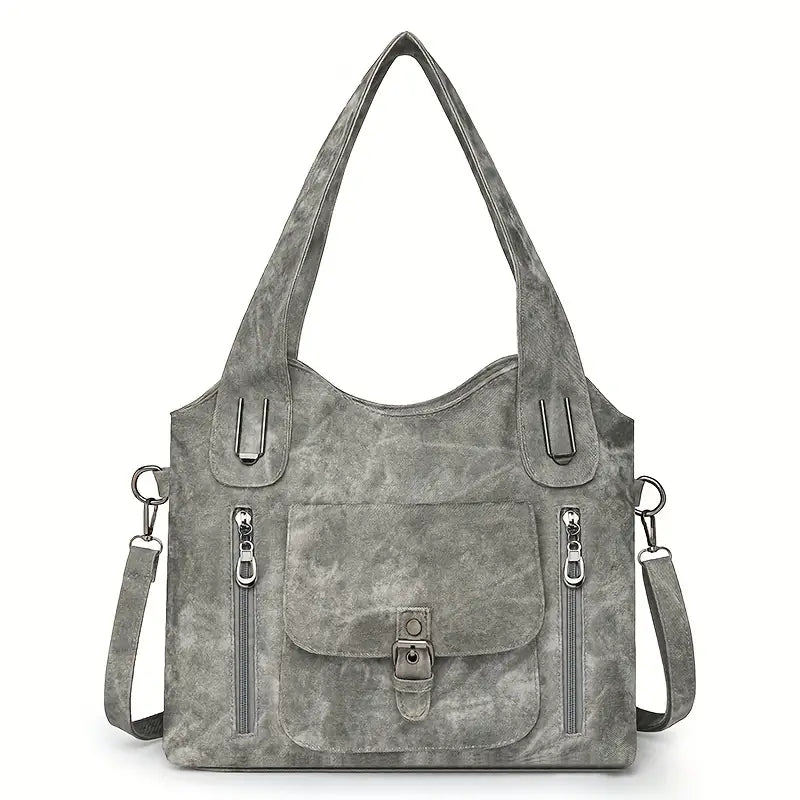 Emilia’s spacious retro-style shoulder bag