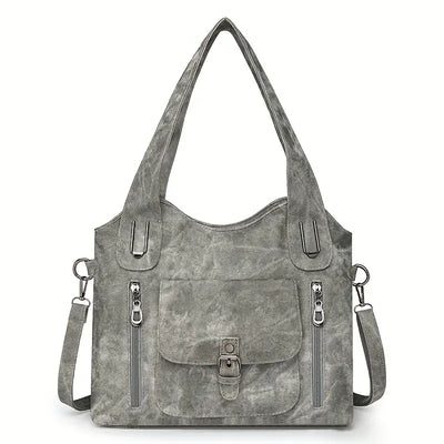 Emilia’s spacious retro-style shoulder bag