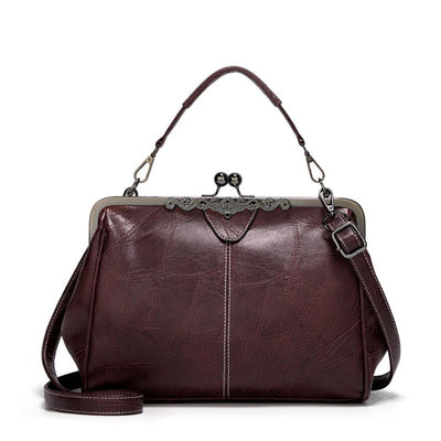 Vintage kiss lock handbag