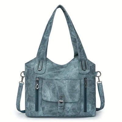 Emilia’s spacious retro-style shoulder bag