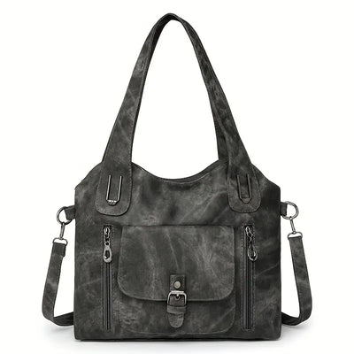 Emilia’s spacious retro-style shoulder bag